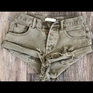 Mid-high waisted distressed Kaitlyn  shorts!